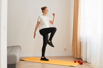 woman exercising at home