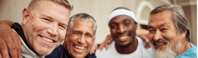 group of middle aged men smiling