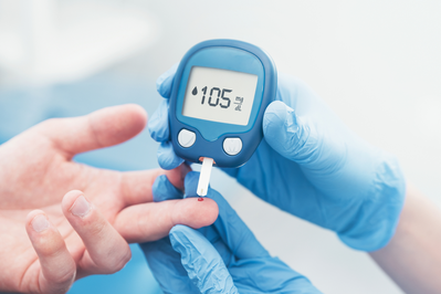 checking blood sugar with glucometer