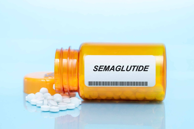 white pills spilling out of bottle labeled Semaglutide