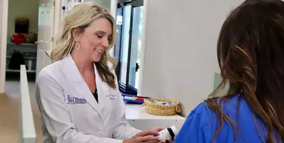 Lori counseling a patient